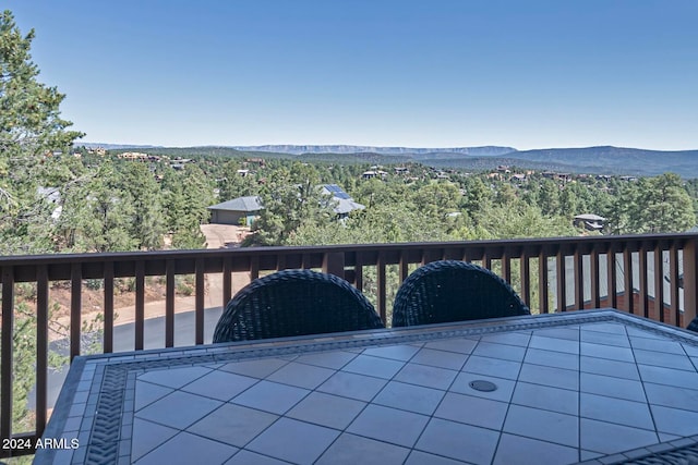 wooden terrace featuring a mountain view