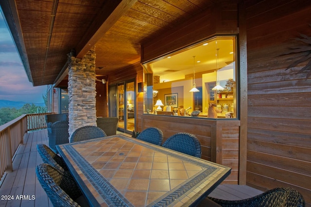 exterior space featuring beamed ceiling, wood-type flooring, wood ceiling, and wood walls