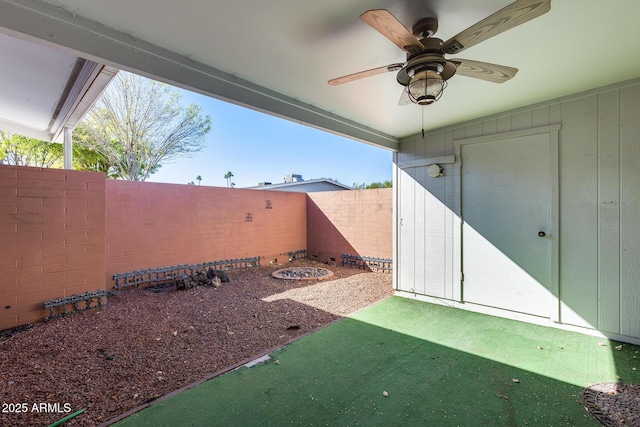 view of yard with ceiling fan