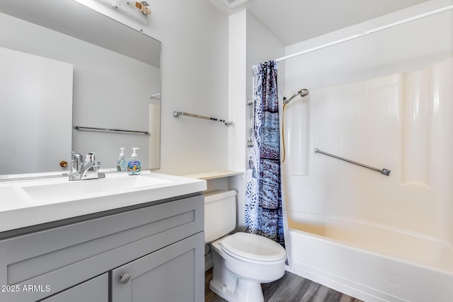 full bathroom with toilet, vanity, hardwood / wood-style flooring, and shower / bathtub combination with curtain