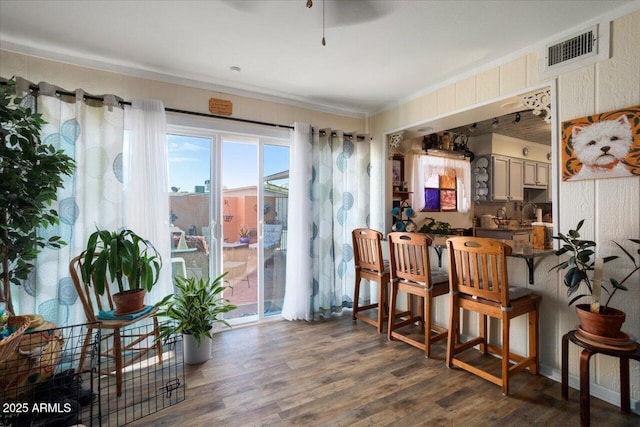 dining area featuring ceiling fan and dark wood-type flooring