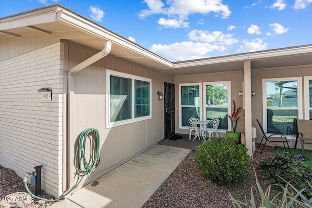 doorway to property with a patio area