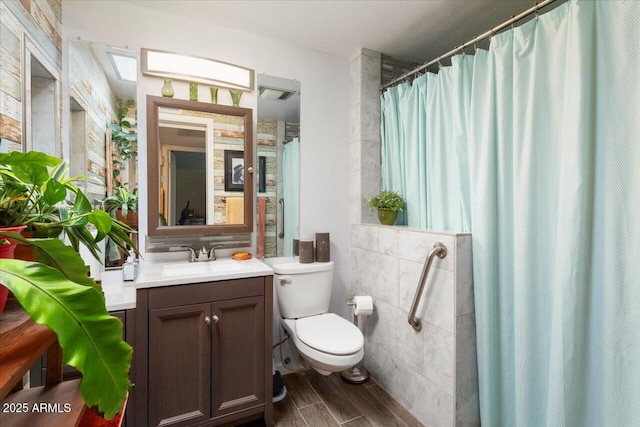 bathroom featuring tile walls, toilet, vanity, and a shower with curtain