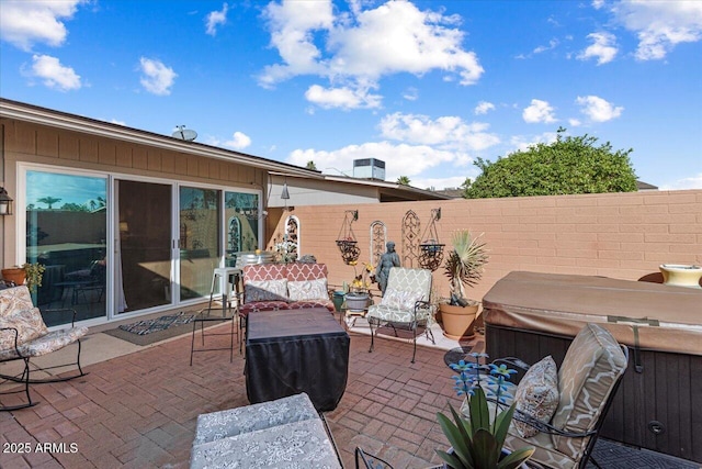 view of patio with a hot tub