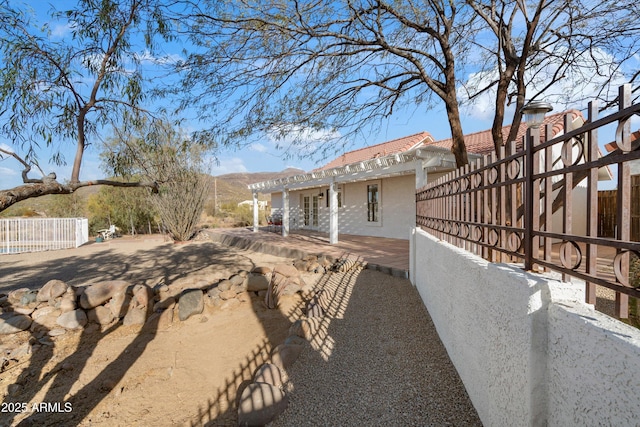 view of side of home featuring a mountain view