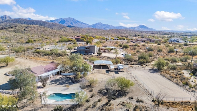 birds eye view of property with a mountain view