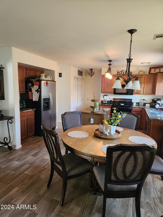 dining area featuring dark wood-type flooring