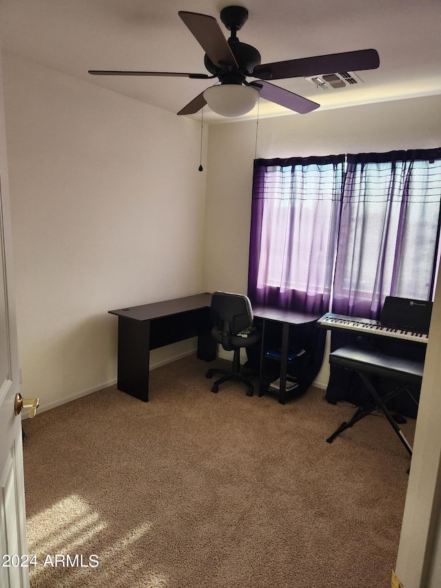 home office featuring ceiling fan and carpet flooring