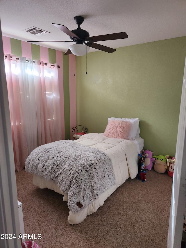 bedroom featuring ceiling fan and carpet flooring