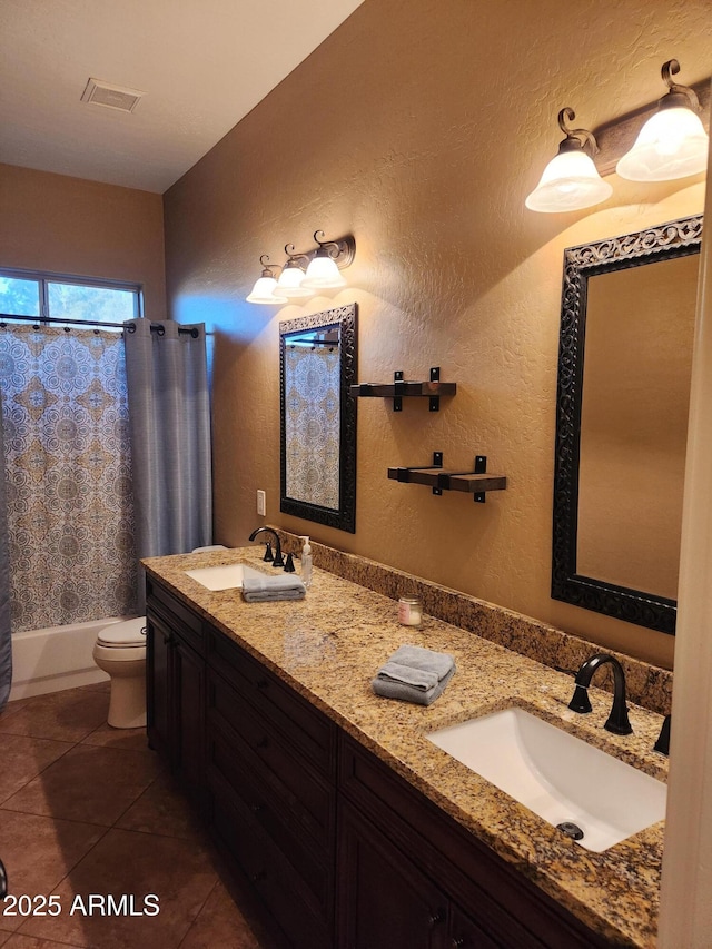 full bathroom featuring tile patterned flooring, vanity, shower / tub combo, and toilet