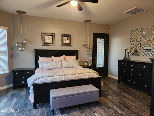 bedroom featuring ceiling fan and dark hardwood / wood-style flooring