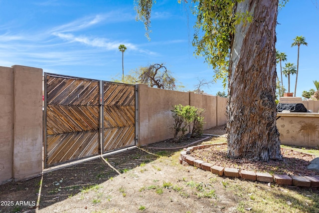 view of yard featuring a gate and fence