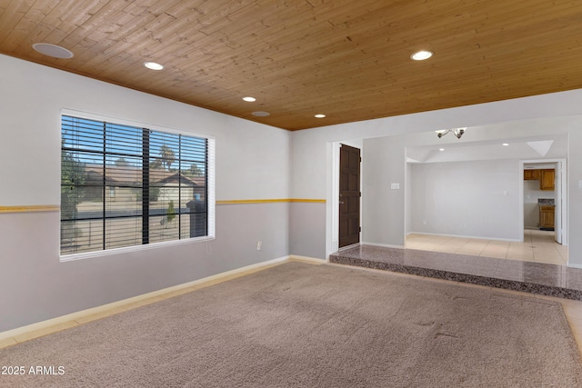 unfurnished room featuring recessed lighting, baseboards, wood ceiling, and carpet flooring