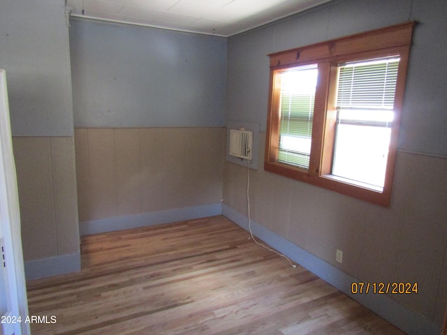 60 Wood Cyn, Bisbee, AZ 85603 - empty room with a wainscoted wall and wood finished floors