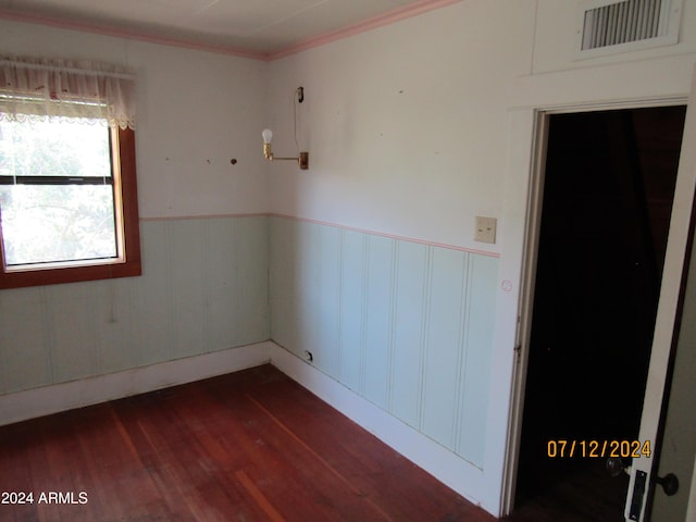 60 Wood Cyn, Bisbee, AZ 85603 - spare room with dark wood-type flooring, ornamental molding, visible vents, and wainscoting