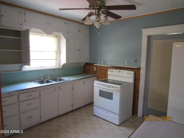 60 Wood Cyn, Bisbee, AZ 85603 - kitchen with white range with electric cooktop, a ceiling fan, a sink, and light countertops
