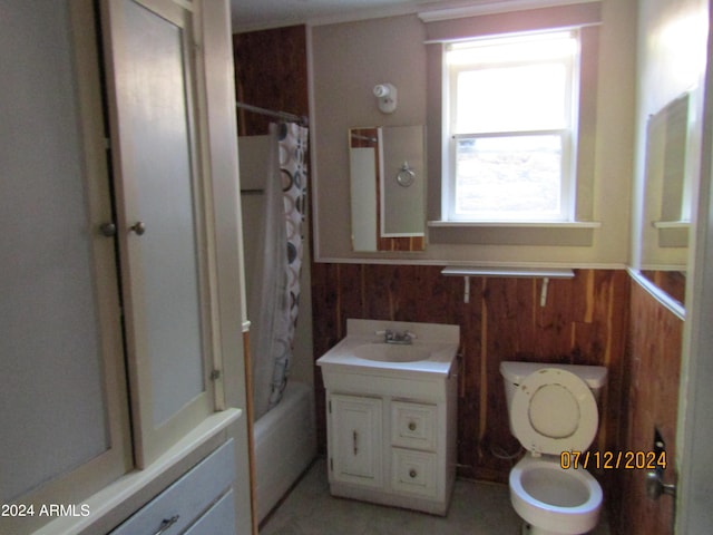 60 Wood Cyn, Bisbee, AZ 85603 - bathroom with vanity, shower / tub combo with curtain, toilet, wooden walls, and wainscoting