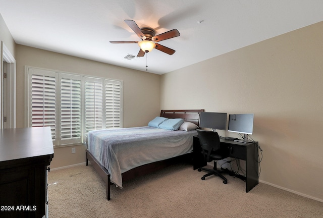 bedroom with ceiling fan and light colored carpet