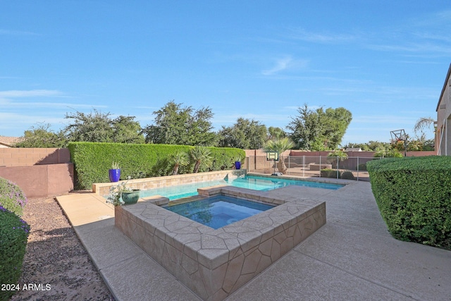 view of pool featuring a fenced in pool, an in ground hot tub, and a fenced backyard