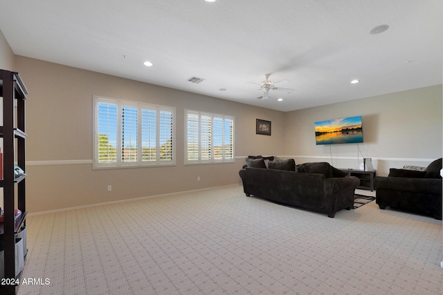living area featuring visible vents, carpet flooring, a ceiling fan, and recessed lighting