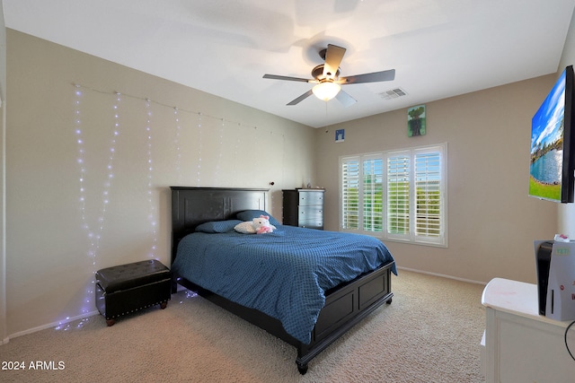 bedroom featuring light colored carpet and ceiling fan