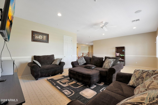 living room featuring recessed lighting, ceiling fan, visible vents, and light carpet