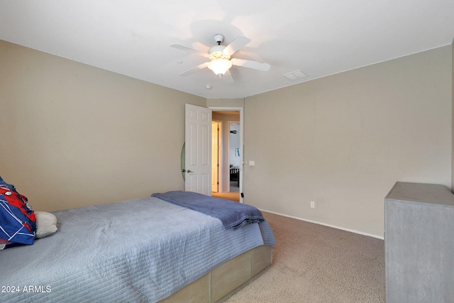 bedroom featuring ceiling fan and light colored carpet