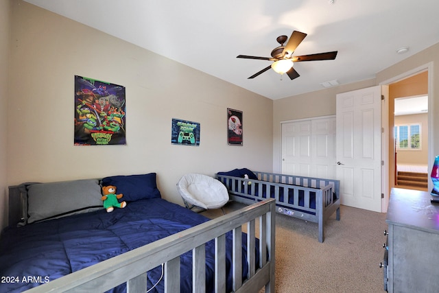 bedroom featuring carpet, a closet, and ceiling fan