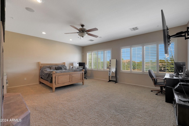 bedroom featuring ceiling fan and light colored carpet