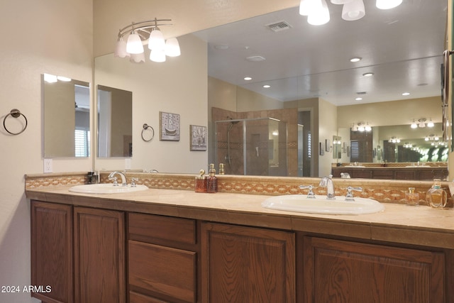 bathroom with vanity and an enclosed shower