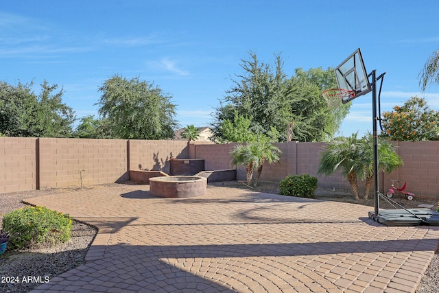 view of patio featuring a fire pit