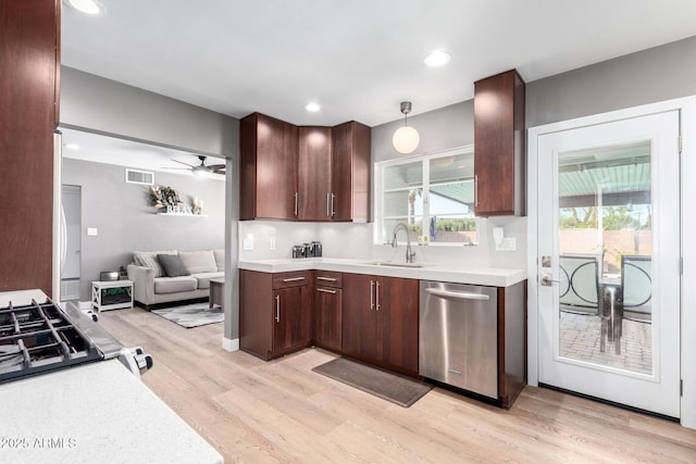 kitchen with sink, decorative light fixtures, light wood-type flooring, stainless steel dishwasher, and ceiling fan