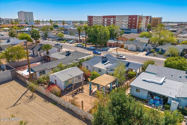 birds eye view of property with a view of city