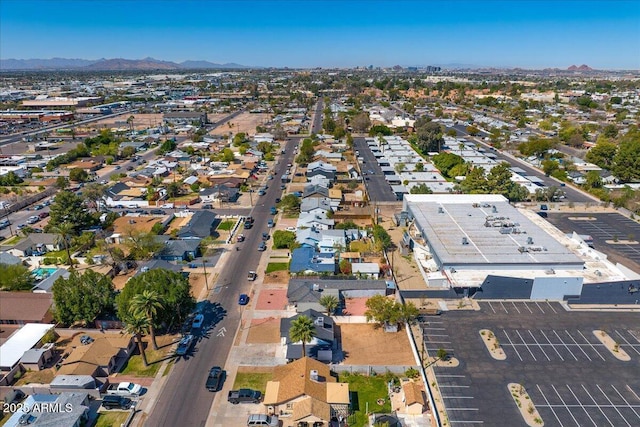 drone / aerial view featuring a residential view and a mountain view