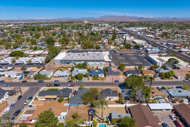 birds eye view of property featuring a mountain view and a residential view