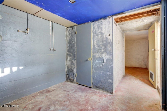 unfinished basement featuring visible vents