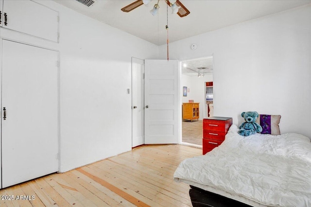 bedroom with hardwood / wood-style floors