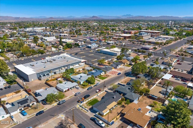 birds eye view of property with a mountain view