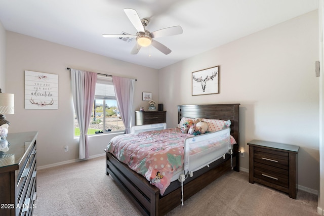 bedroom featuring visible vents, light colored carpet, baseboards, and ceiling fan