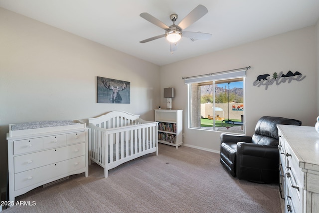 bedroom featuring baseboards, a ceiling fan, and carpet floors