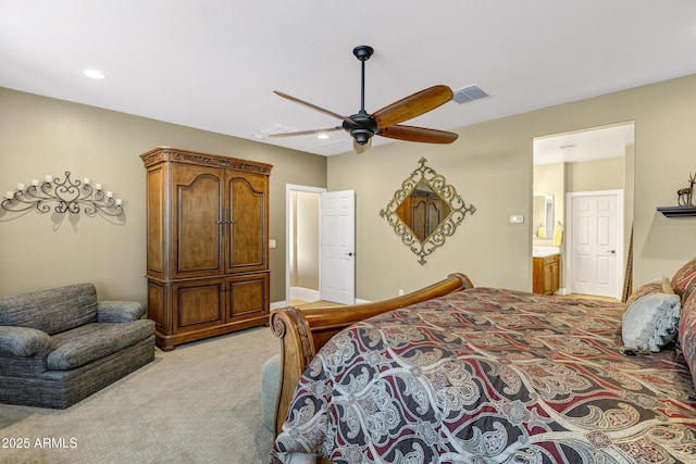 carpeted bedroom featuring connected bathroom and ceiling fan