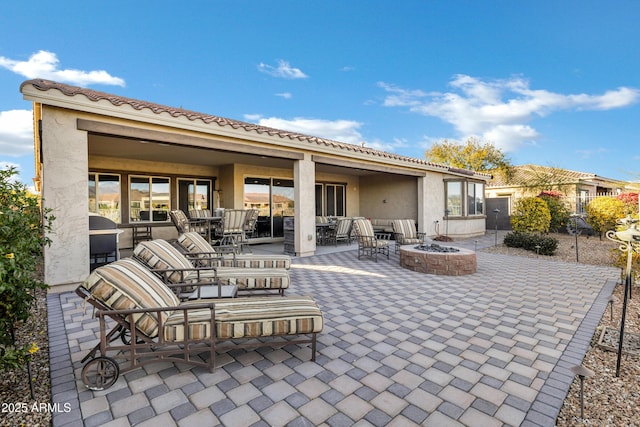 view of patio with a fire pit