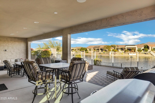 view of patio featuring a water view