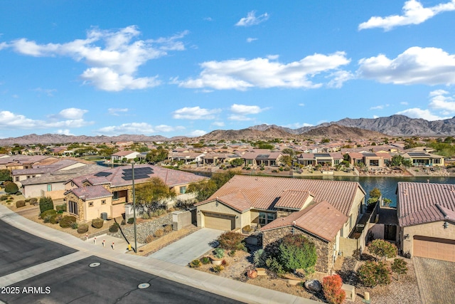 birds eye view of property with a mountain view