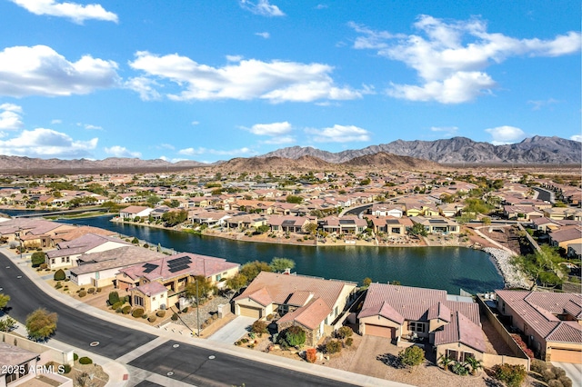 birds eye view of property featuring a water and mountain view