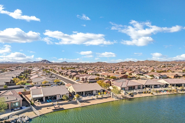 aerial view featuring a water and mountain view