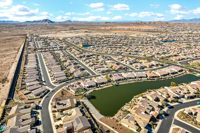 drone / aerial view featuring a water and mountain view