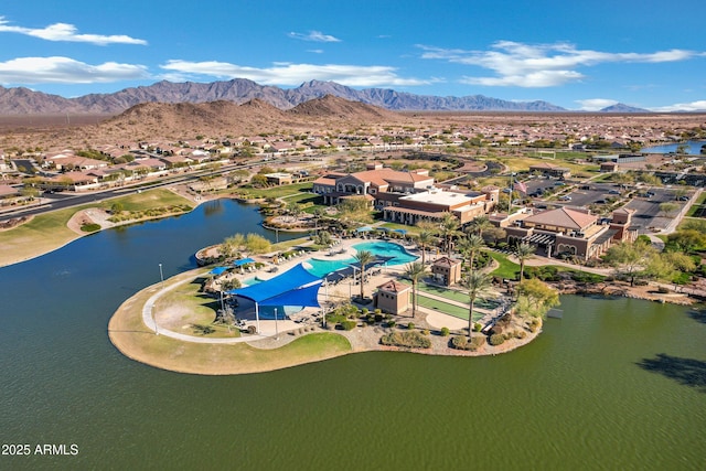 drone / aerial view featuring a water and mountain view