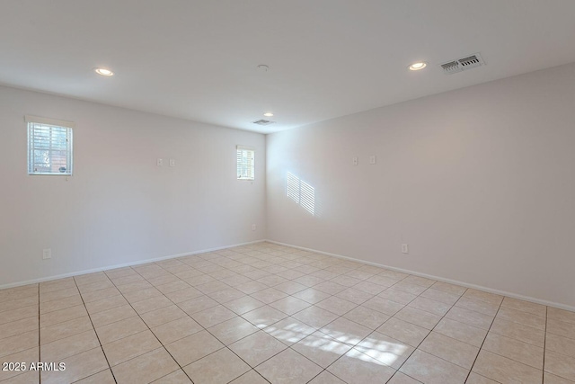 spare room with light tile patterned flooring, visible vents, recessed lighting, and baseboards