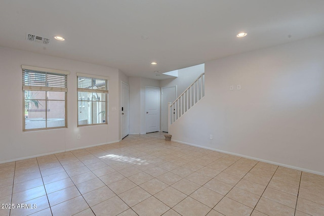 foyer entrance featuring visible vents, baseboards, light tile patterned flooring, recessed lighting, and stairs